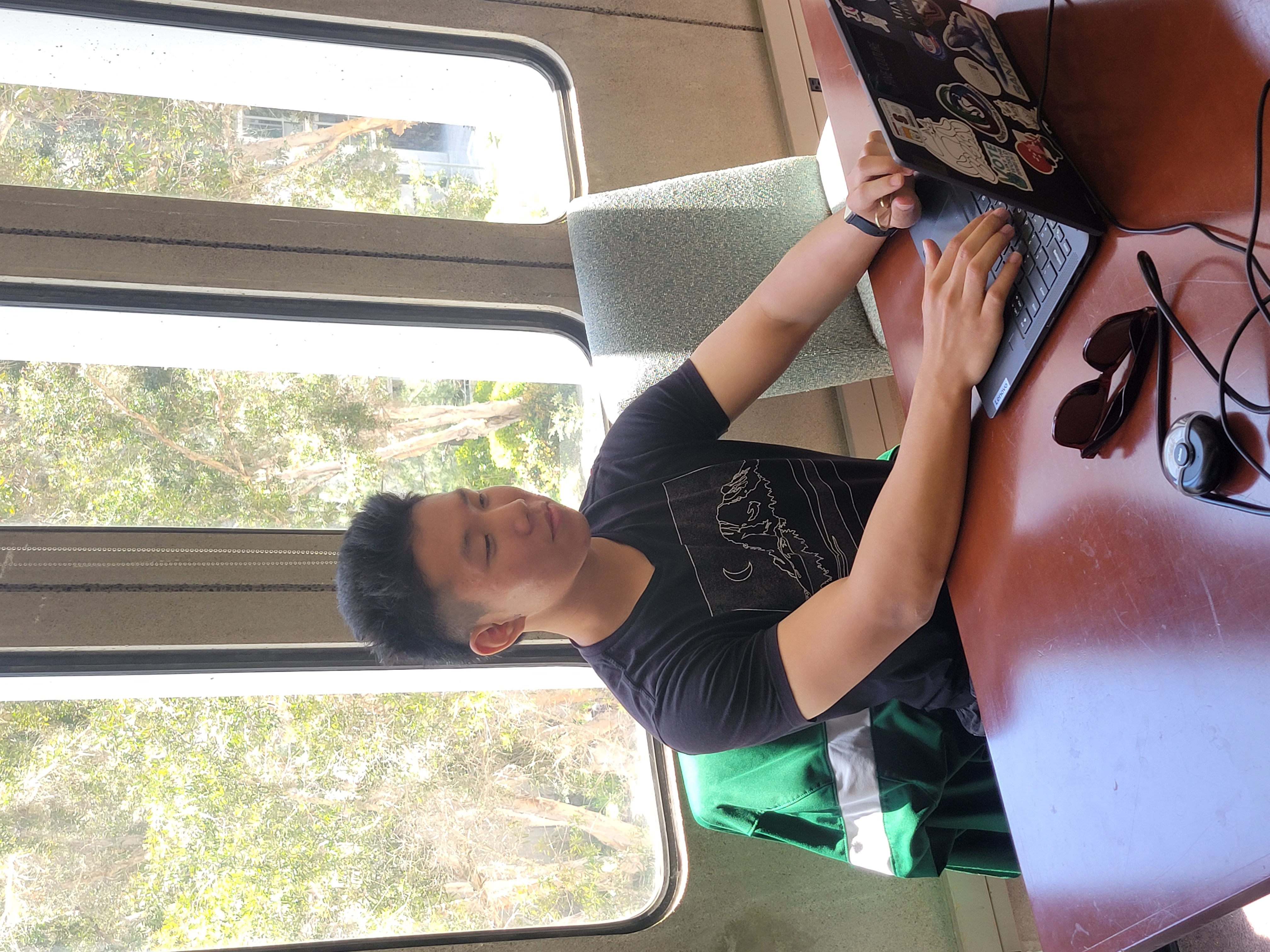 Students collaborating in a modern classroom with folding walls